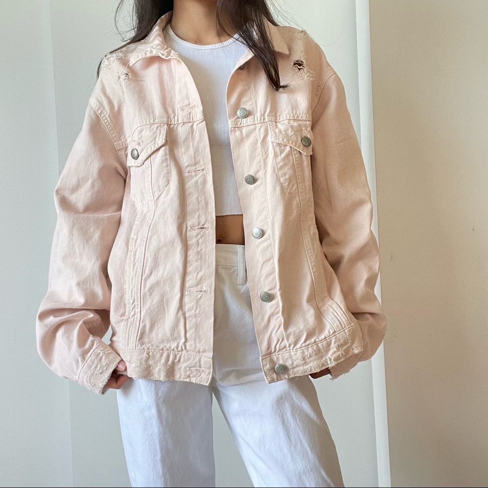 Pink oversized distressed denim jacket